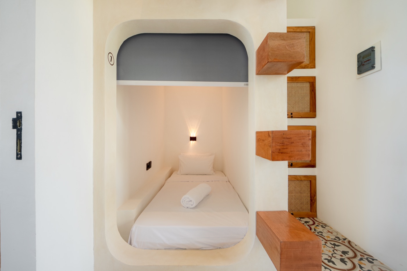 Single sleeping pod with reading light and fresh towel