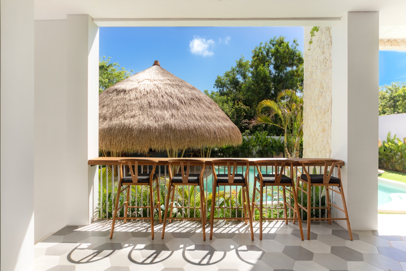 Bar seats overlooking the pool